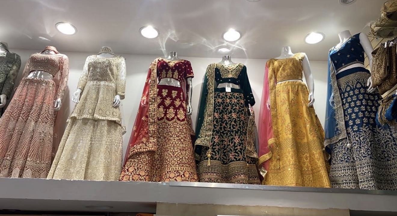 Bridal lehengas and embroidered outfits on display at Elegance Boutique